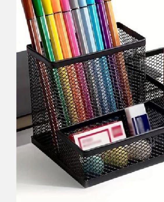 Black mesh desk organiser with pen compartments and a stationery tray